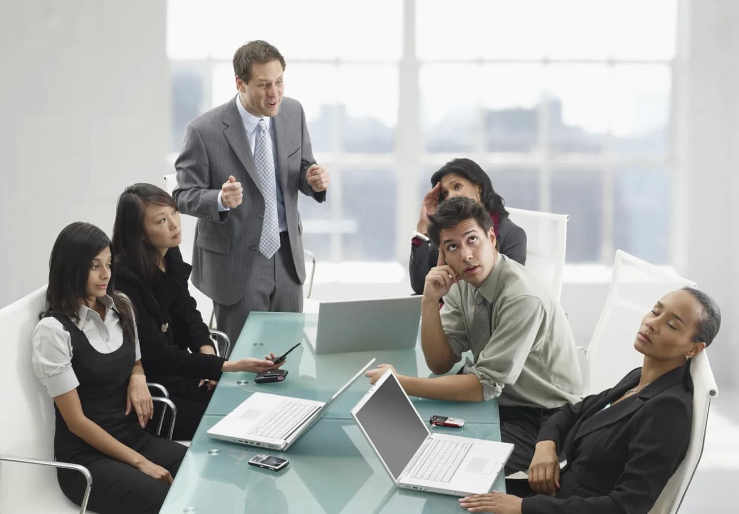 A team discussing work around a conference table.