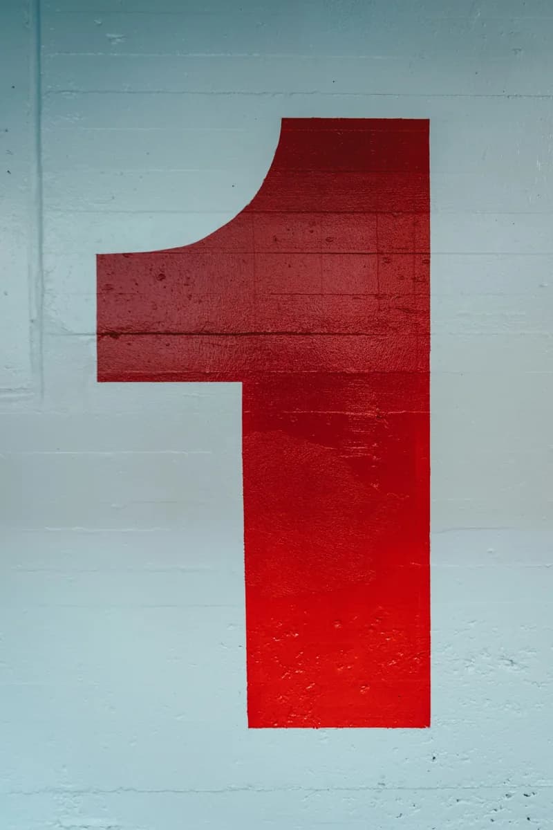 A large red number one painted on a wall.