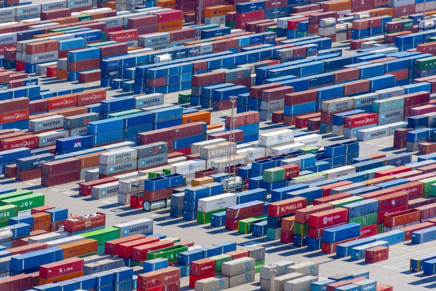 Rows of stacked shipping containers.